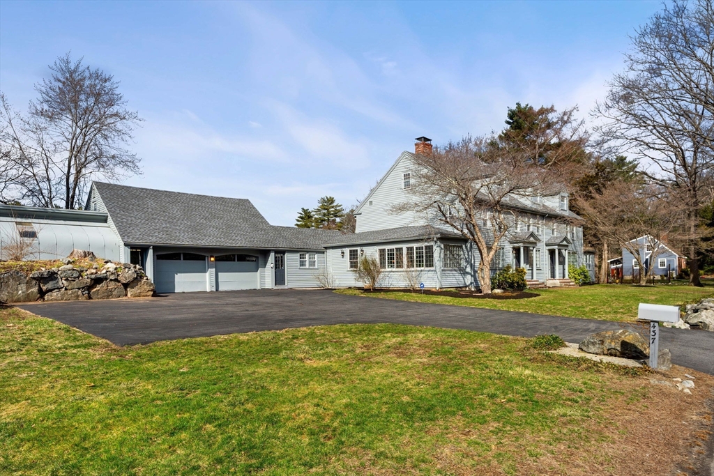 437 Linebrook Road Ipswich, MA 01938 - Photo 35 of 41 a view of a house with a big yard and large trees