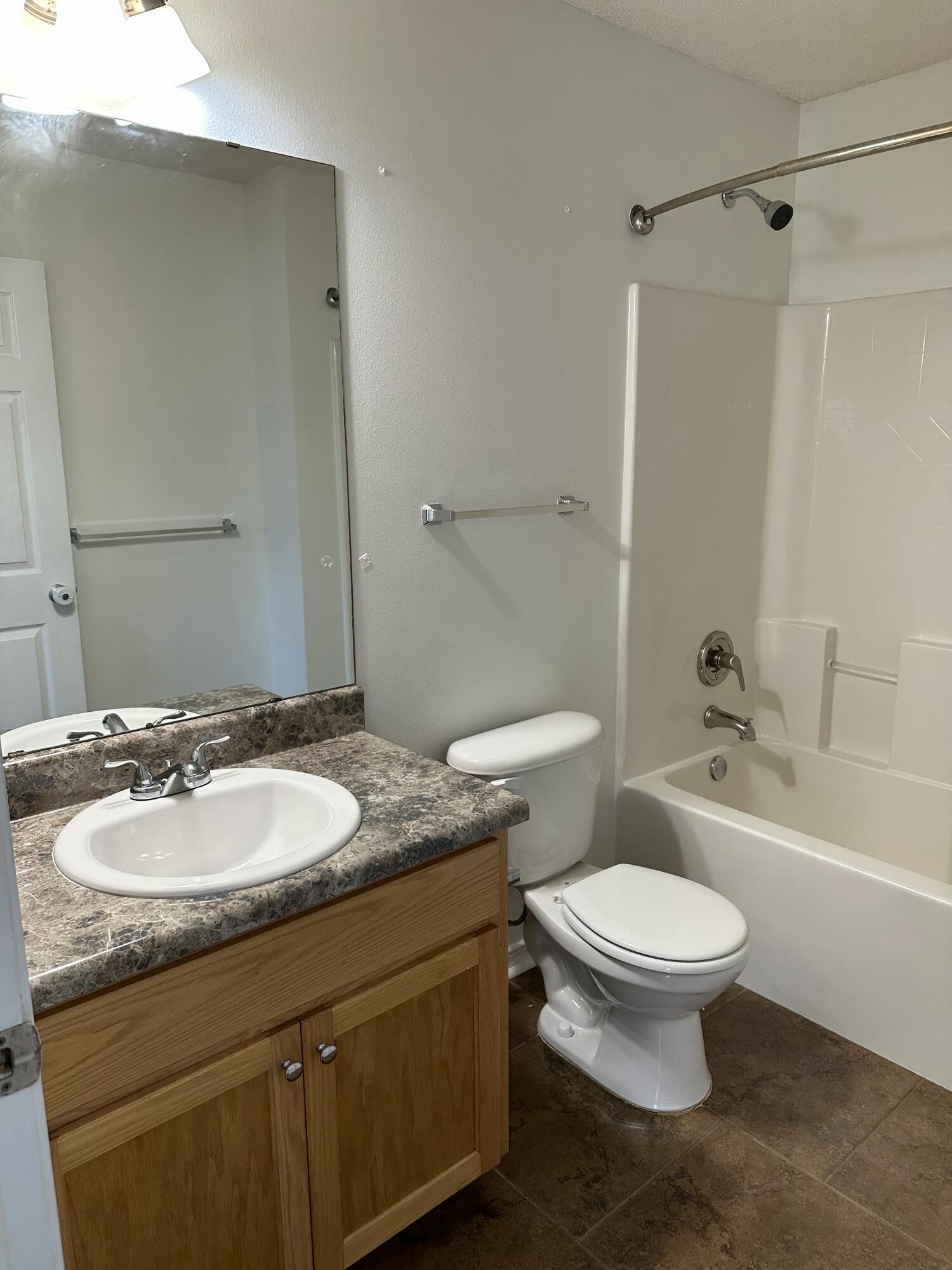 4195 Berry Circle Pace, FL 32571 - Photo 15 of 50 a bathroom with a granite countertop sink toilet a mirror and shower