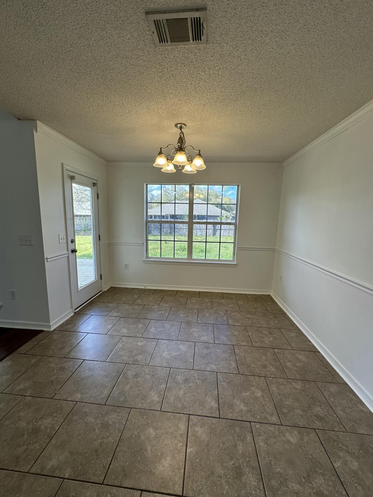 4195 Berry Circle Pace, FL 32571 - Photo 30 of 50 a view of an empty room with a window