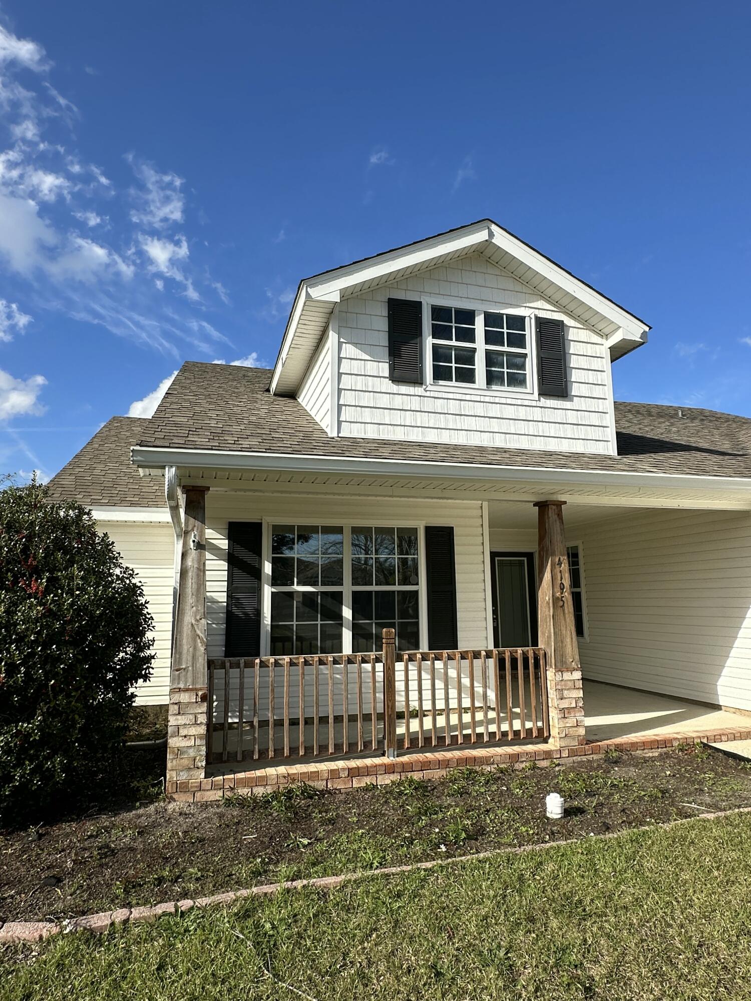 4195 Berry Circle Pace, FL 32571 - Photo 3 of 50 a front view of a house with a porch