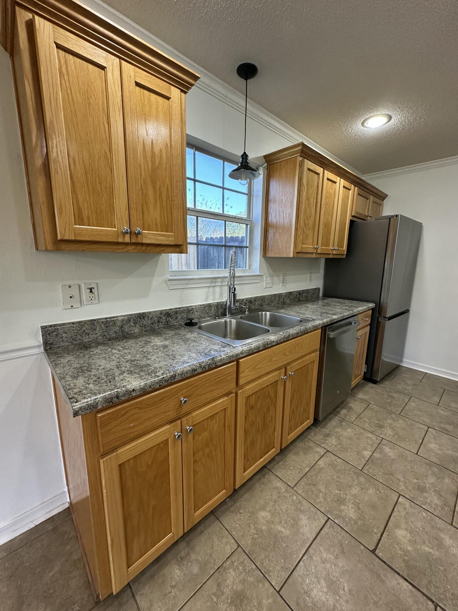 4195 Berry Circle Pace, FL 32571 - Photo 34 of 50 a kitchen with a sink cabinets and window