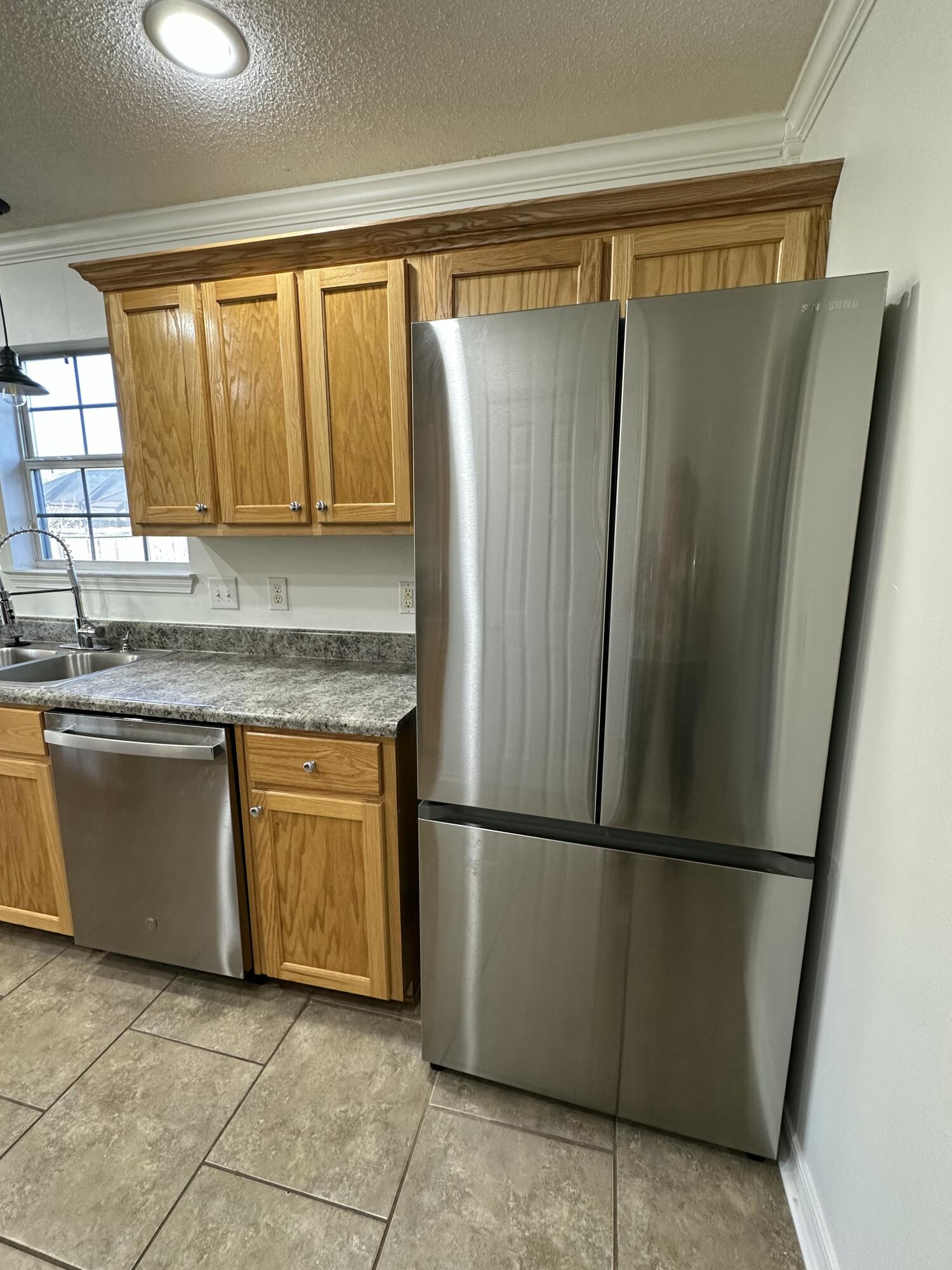 4195 Berry Circle Pace, FL 32571 - Photo 35 of 50 a kitchen with stainless steel appliances granite countertop a refrigerator and a sink