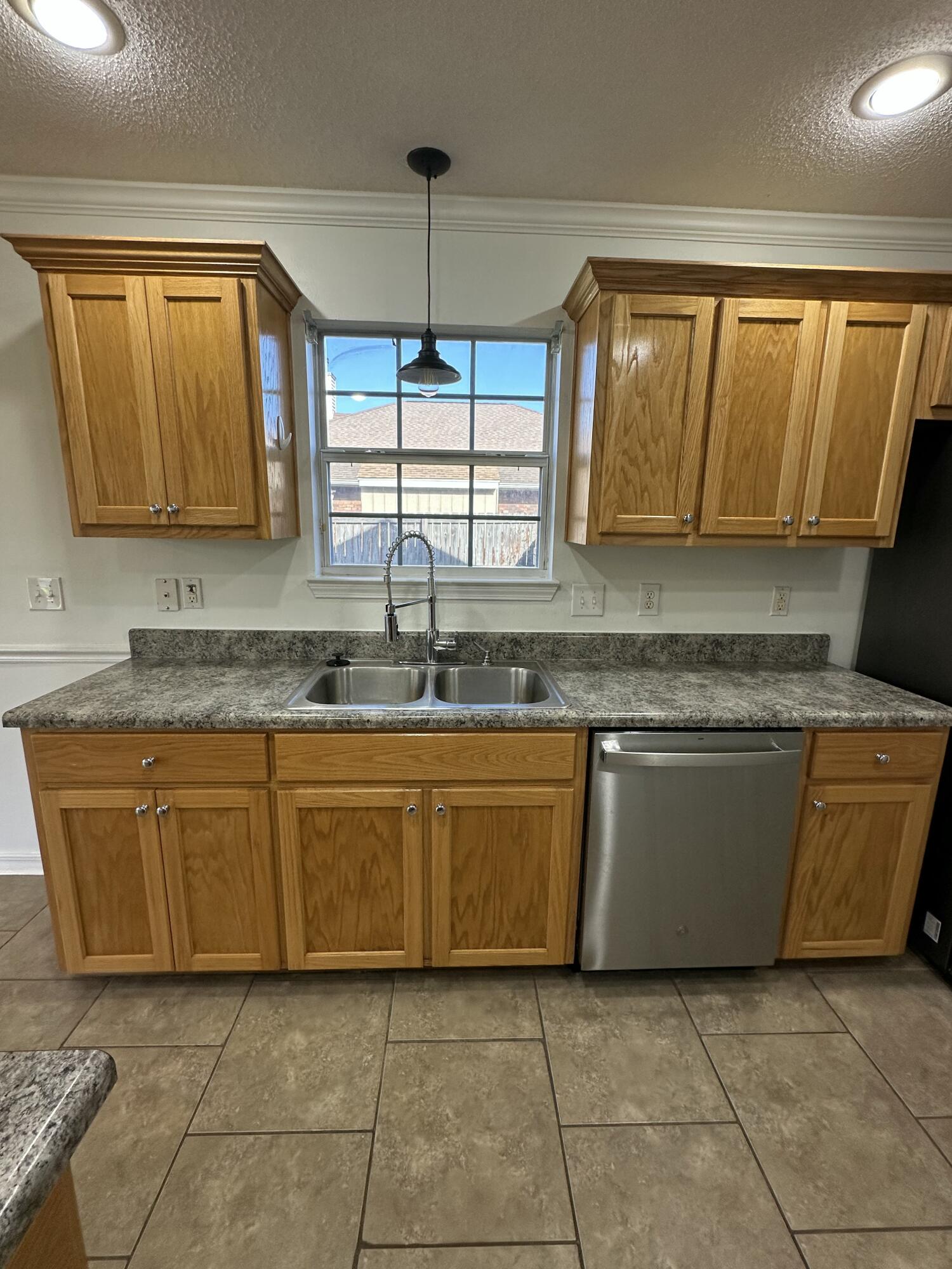 4195 Berry Circle Pace, FL 32571 - Photo 36 of 50 a kitchen with granite countertop a sink and a counter top space