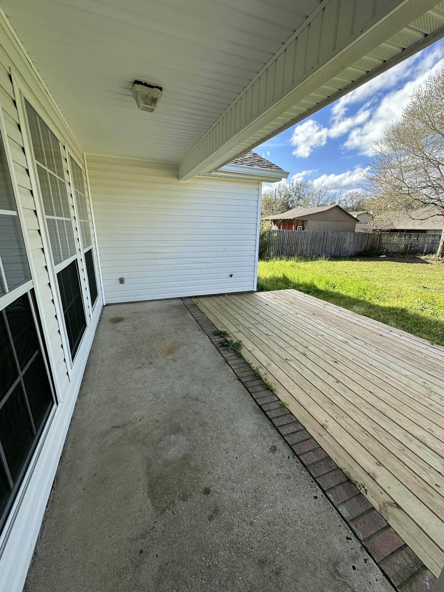 4195 Berry Circle Pace, FL 32571 - Photo 46 of 50 a view of an empty room with a sink and wooden floor