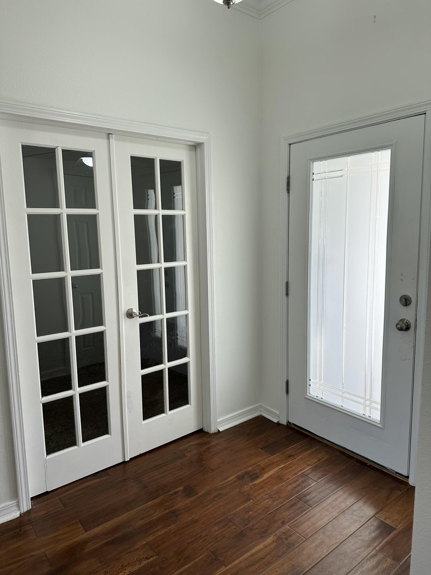 4195 Berry Circle Pace, FL 32571 - Photo 6 of 50 a view of an empty room with wooden floor and windows