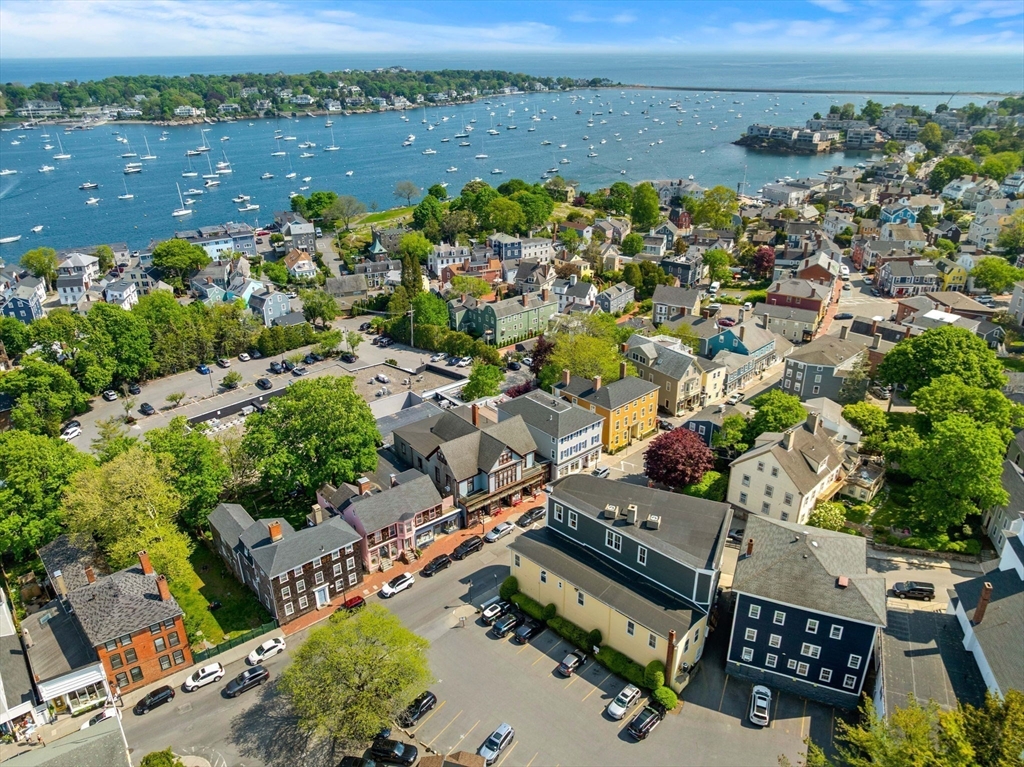 44 Pleasant Street, Unit 1 Marblehead, MA 01945 - Photo 32 of 35 an aerial view of a houses with a lake view