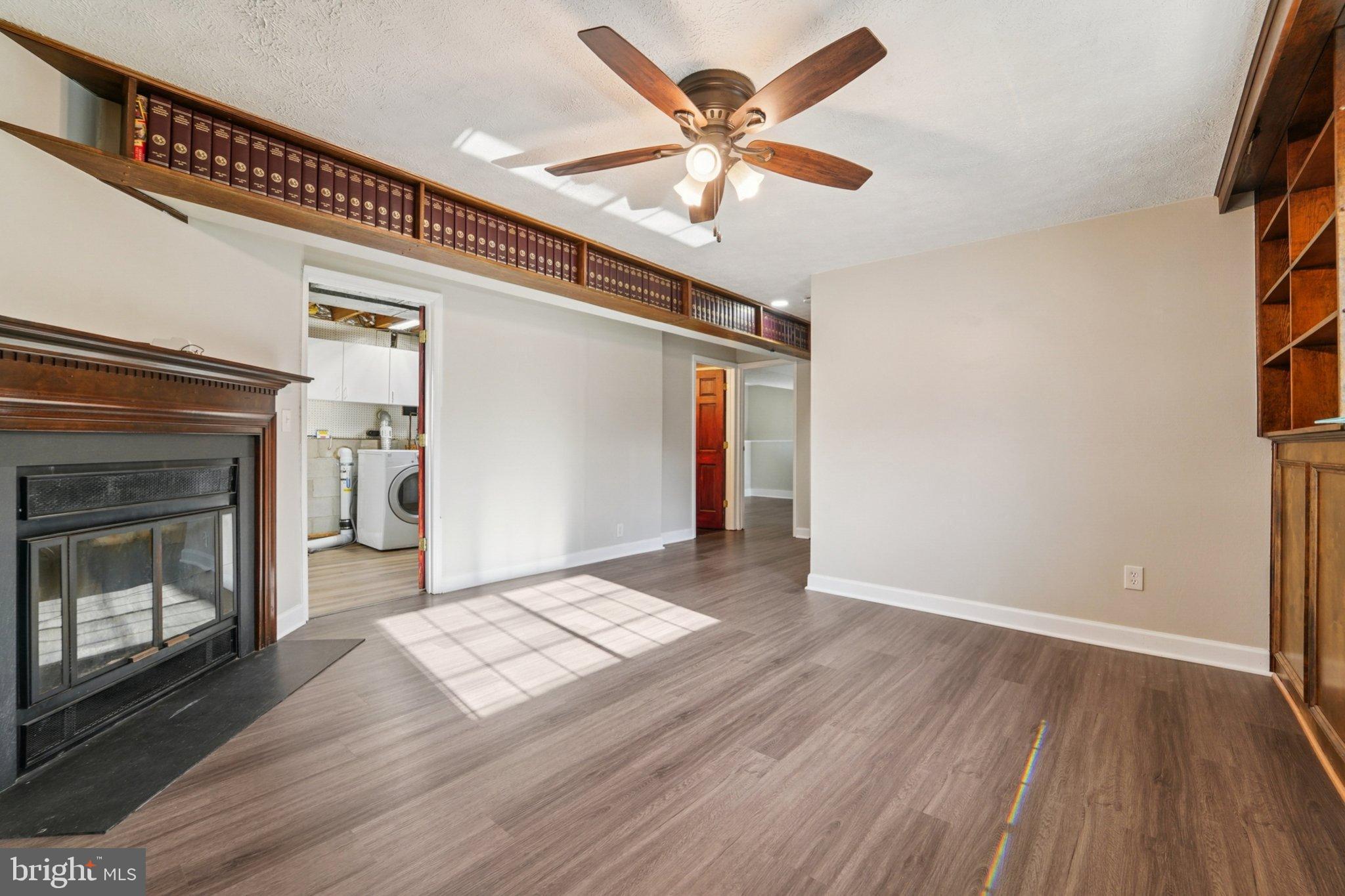 308 Raussell Place Severna Park, MD 21146 - Photo 17 of 31 a view of an empty room with window and wooden floor
