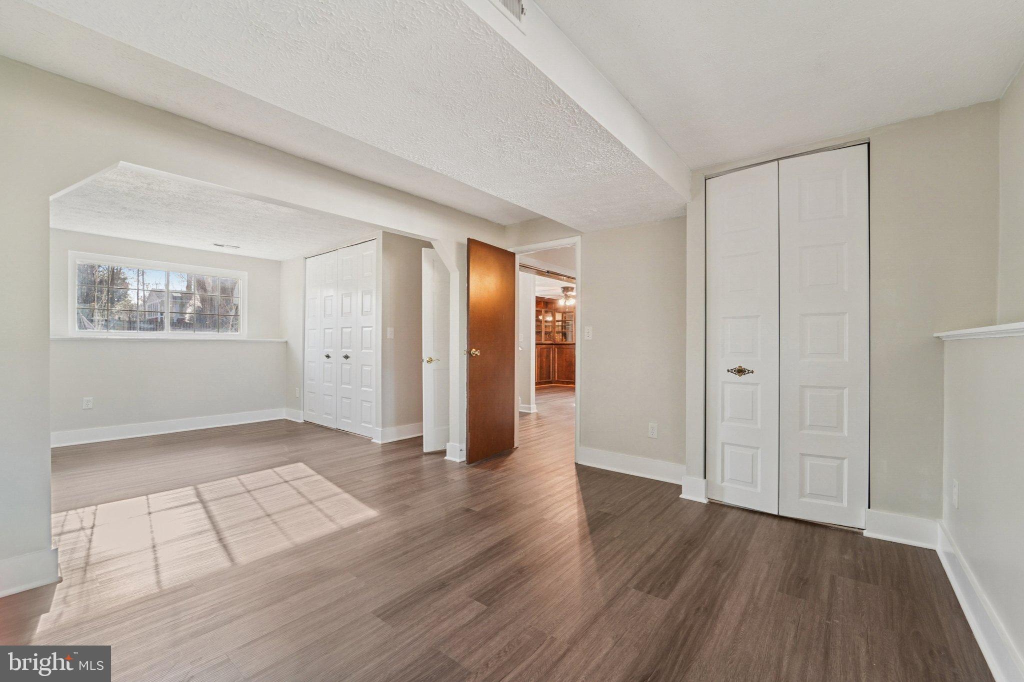 308 Raussell Place Severna Park, MD 21146 - Photo 19 of 31 an empty room with wooden floor and windows