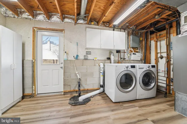 a utility room with closet dryer and washer