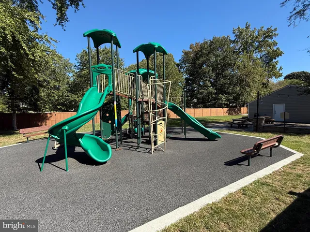 a park with wooden stairs and some trees