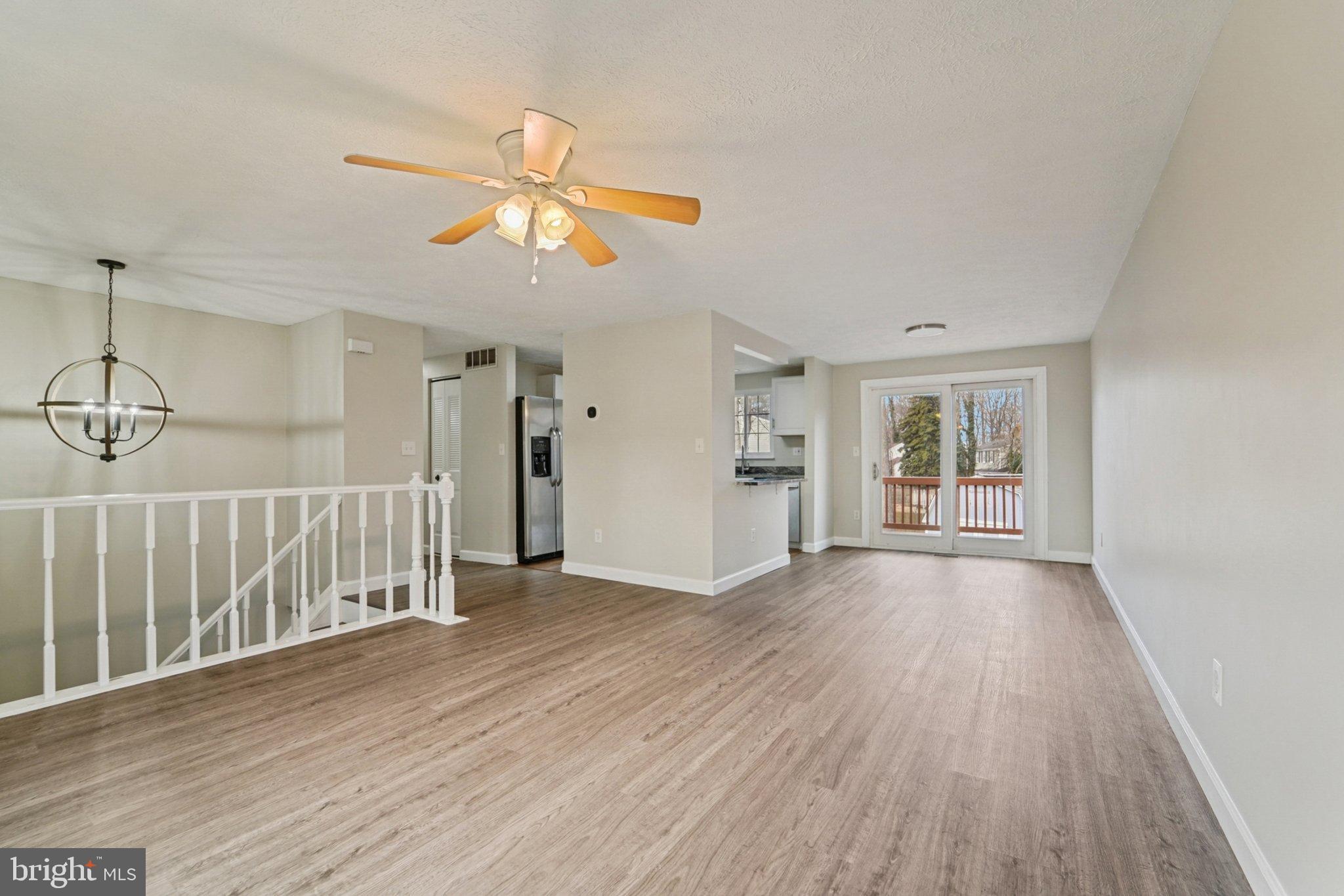 308 Raussell Place Severna Park, MD 21146 - Photo 6 of 31 a view of empty room with wooden floor and fan