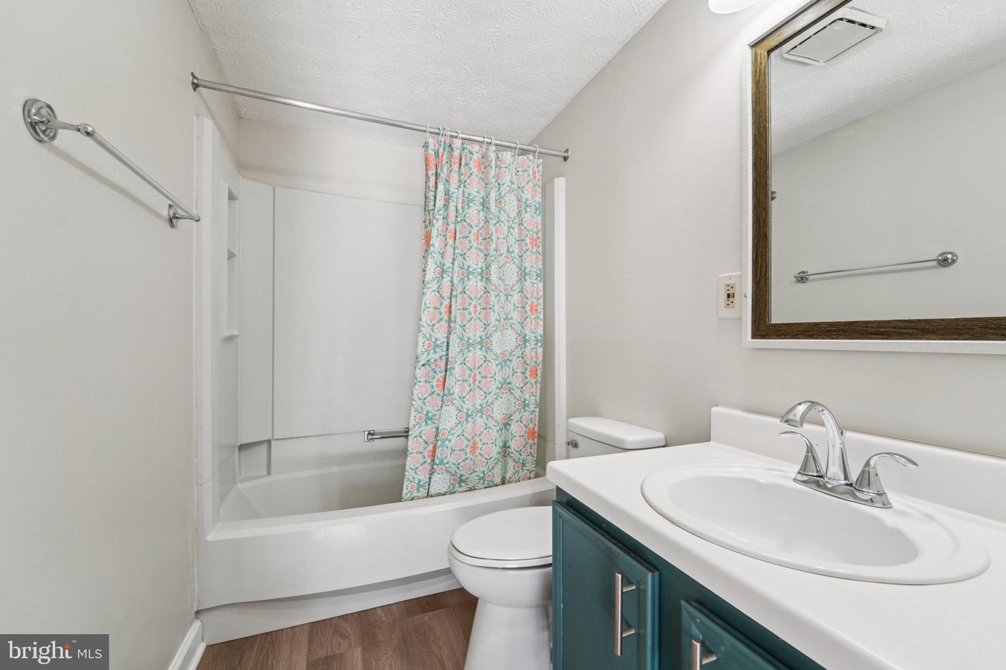 308 Raussell Place Severna Park, MD 21146 - Photo 10 of 31 a bathroom with a sink a toilet and shower