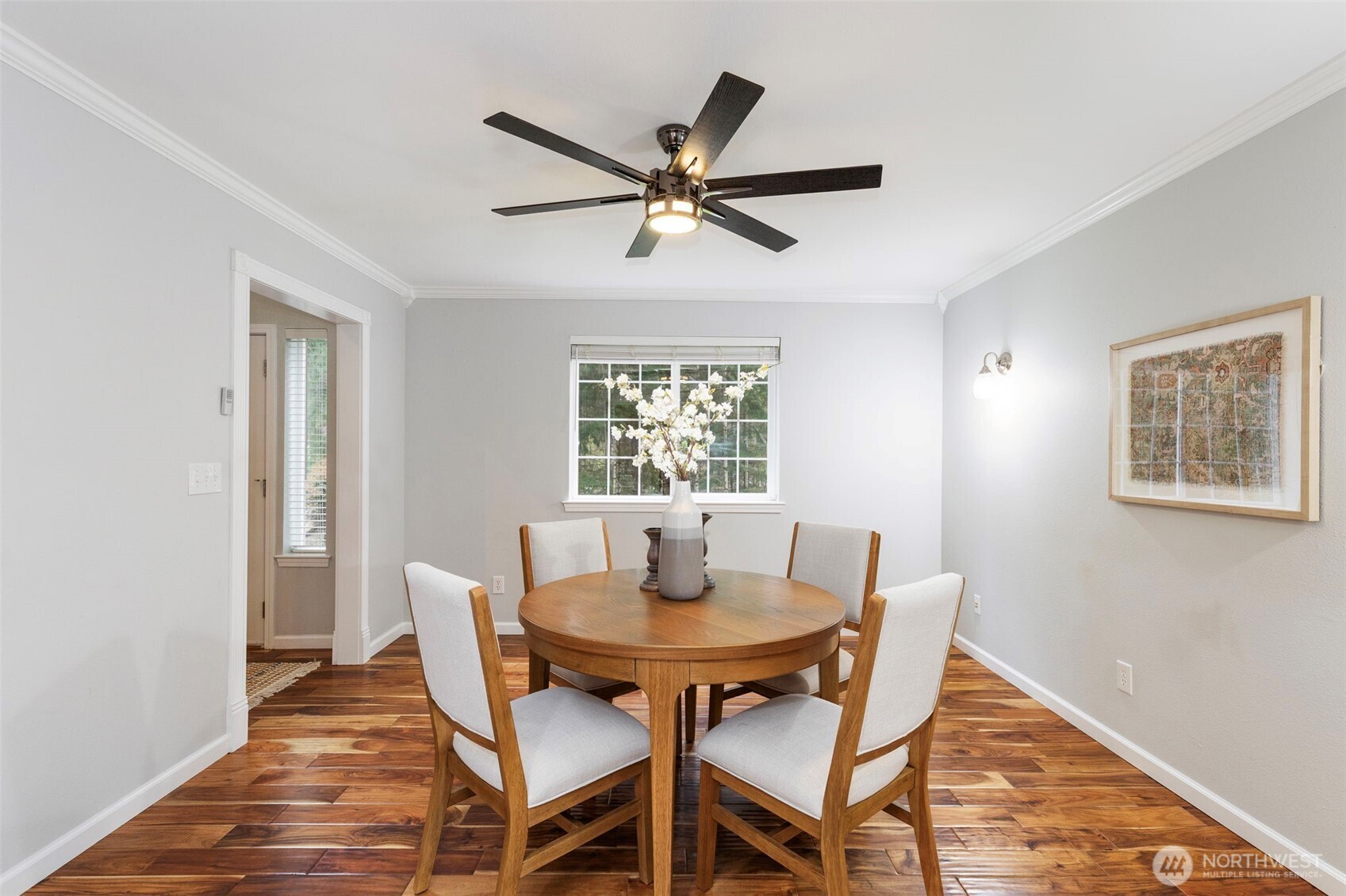 15219 Wright Bliss Road Northwest Gig Harbor, WA 98329 - Photo 12 of 39 a view of a dining room with a table and chairs