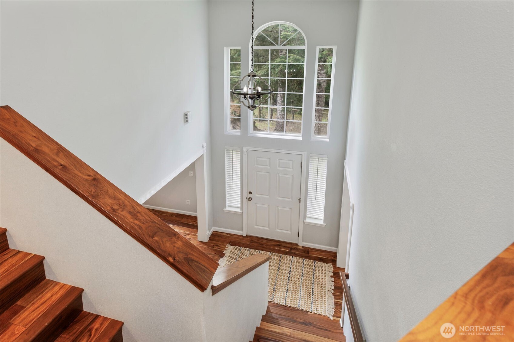 15219 Wright Bliss Road Northwest Gig Harbor, WA 98329 - Photo 20 of 39 a view of staircase with white walls and windows