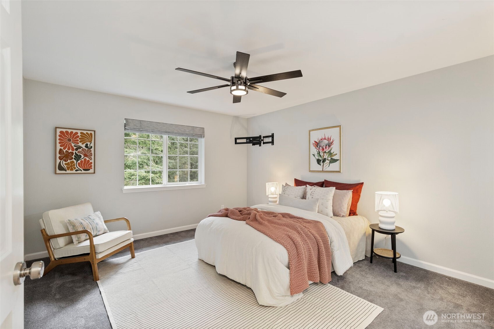 15219 Wright Bliss Road Northwest Gig Harbor, WA 98329 - Photo 21 of 39 a bedroom with a bed couches and window