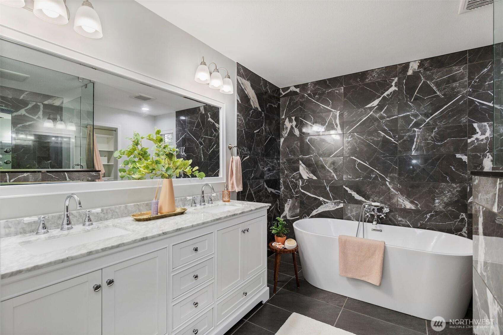 15219 Wright Bliss Road Northwest Gig Harbor, WA 98329 - Photo 23 of 39 a bathroom with a sink and mirror