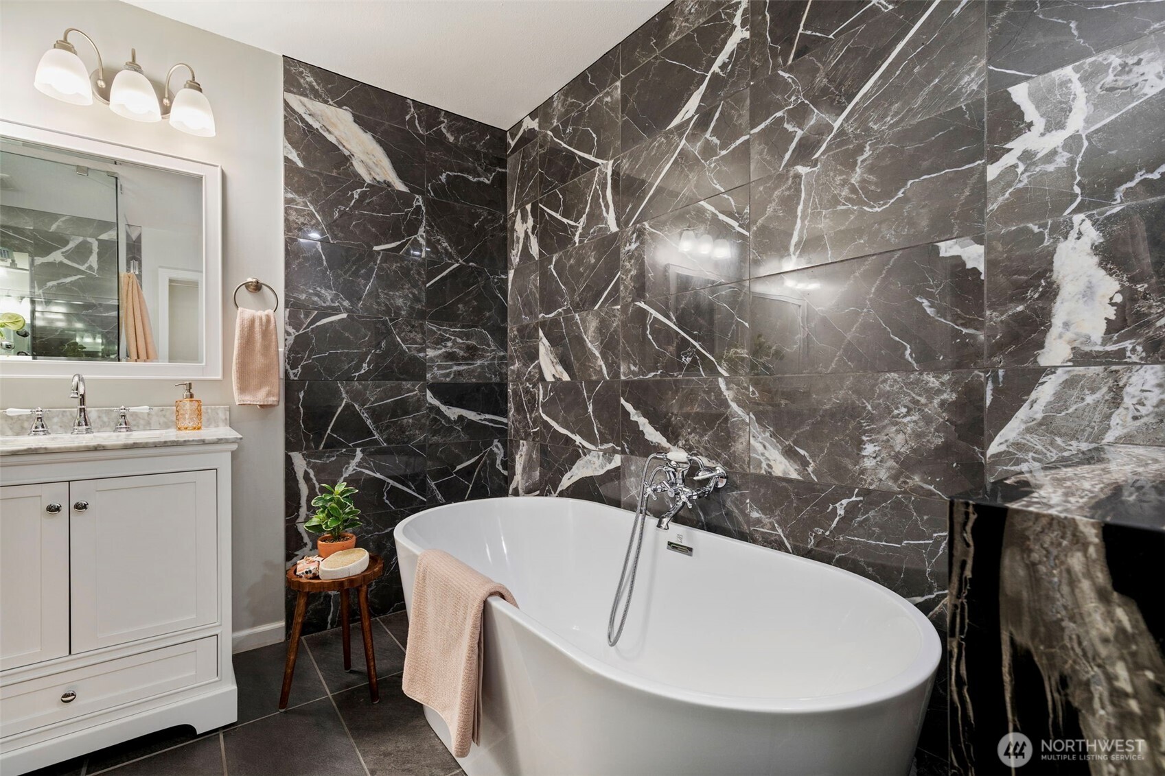 15219 Wright Bliss Road Northwest Gig Harbor, WA 98329 - Photo 24 of 39 a bathroom with a sink and mirror