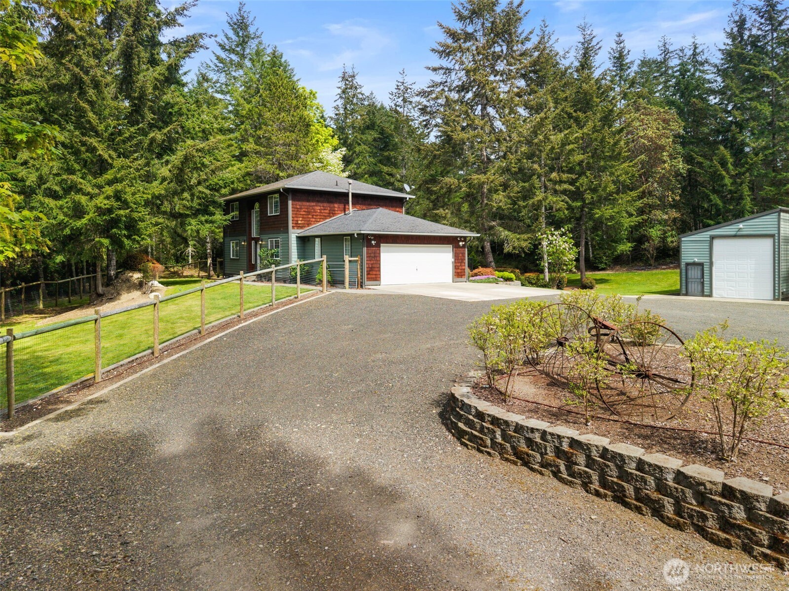 15219 Wright Bliss Road Northwest Gig Harbor, WA 98329 - Photo 3 of 39 a house with trees in the background