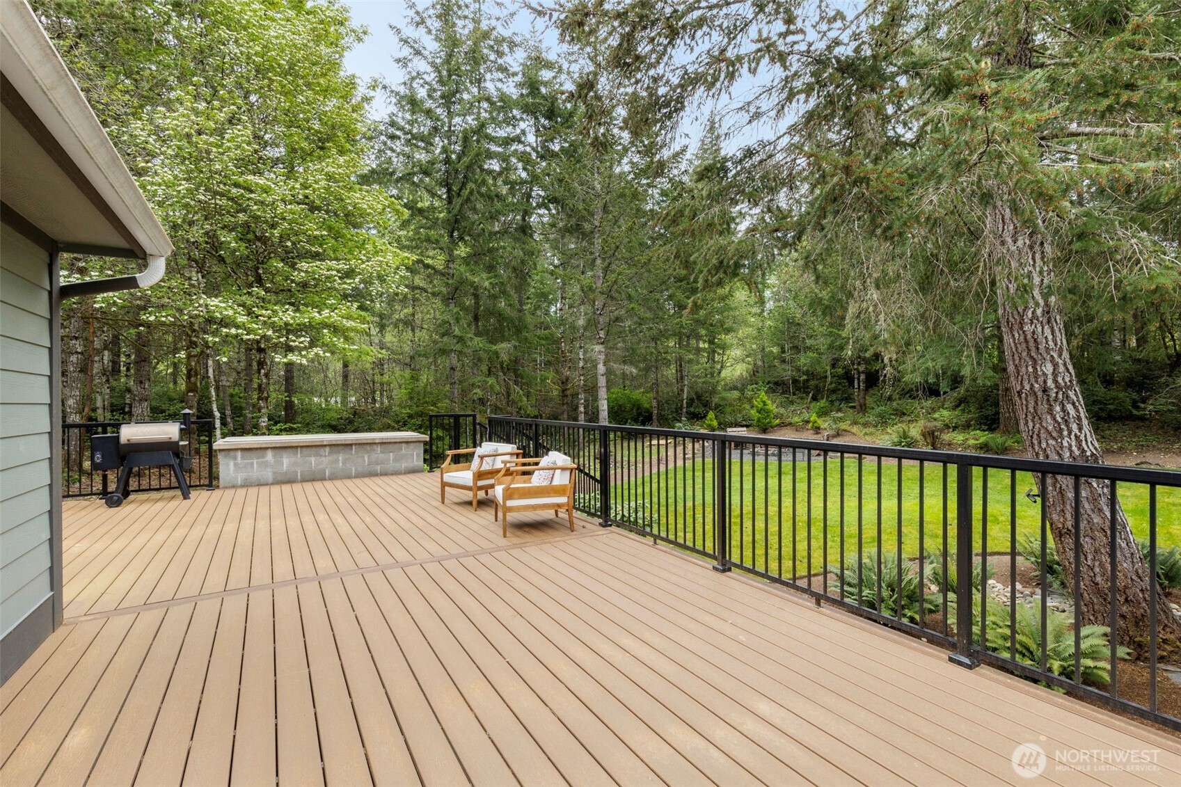 15219 Wright Bliss Road Northwest Gig Harbor, WA 98329 - Photo 31 of 39 a view of balcony with wooden floor and seating space