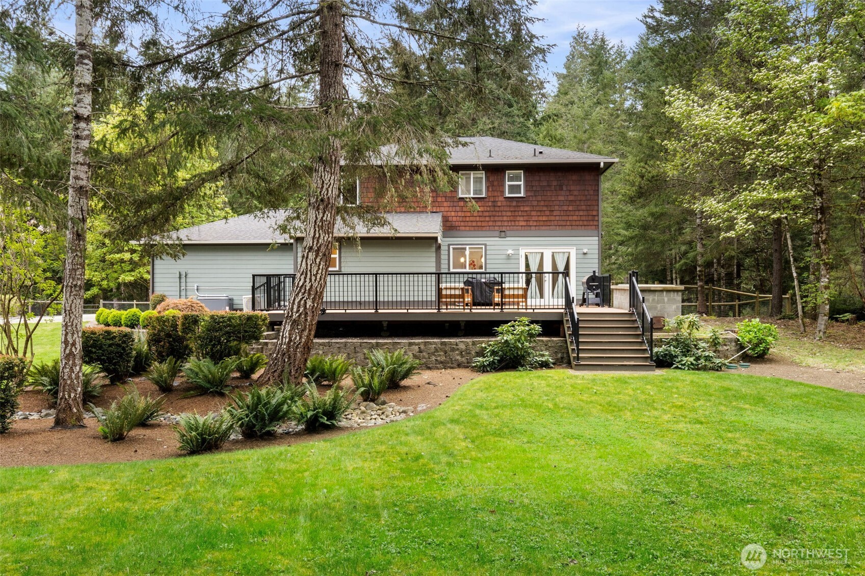 15219 Wright Bliss Road Northwest Gig Harbor, WA 98329 - Photo 33 of 39 a view of a house with a yard and sitting area