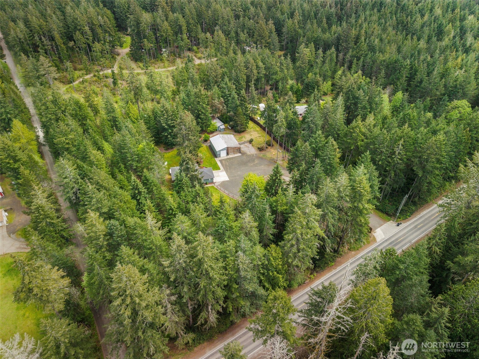 15219 Wright Bliss Road Northwest Gig Harbor, WA 98329 - Photo 38 of 39 a aerial view of a house with a yard