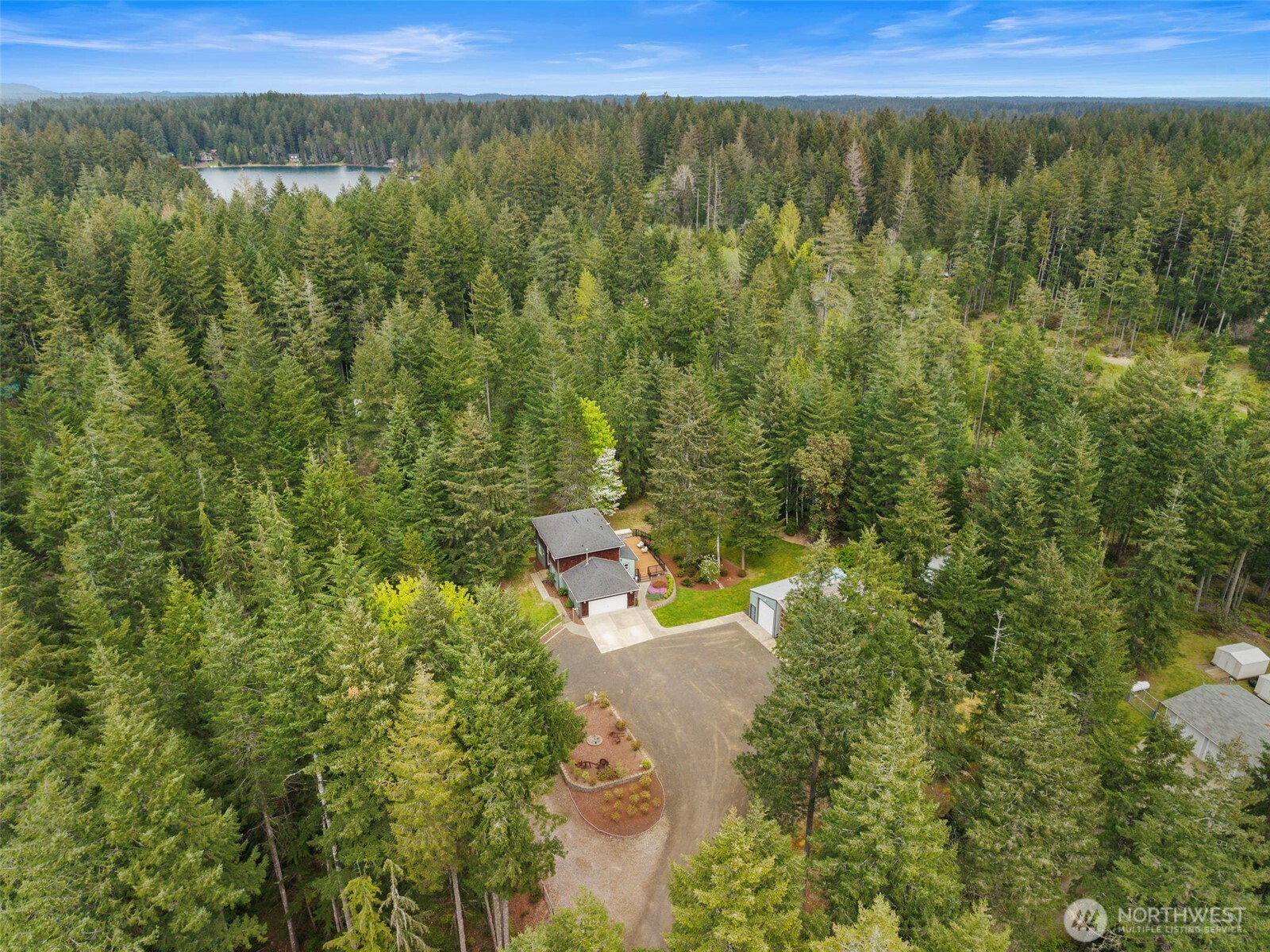 15219 Wright Bliss Road Northwest Gig Harbor, WA 98329 - Photo 39 of 39 a view of a city with lush green forest