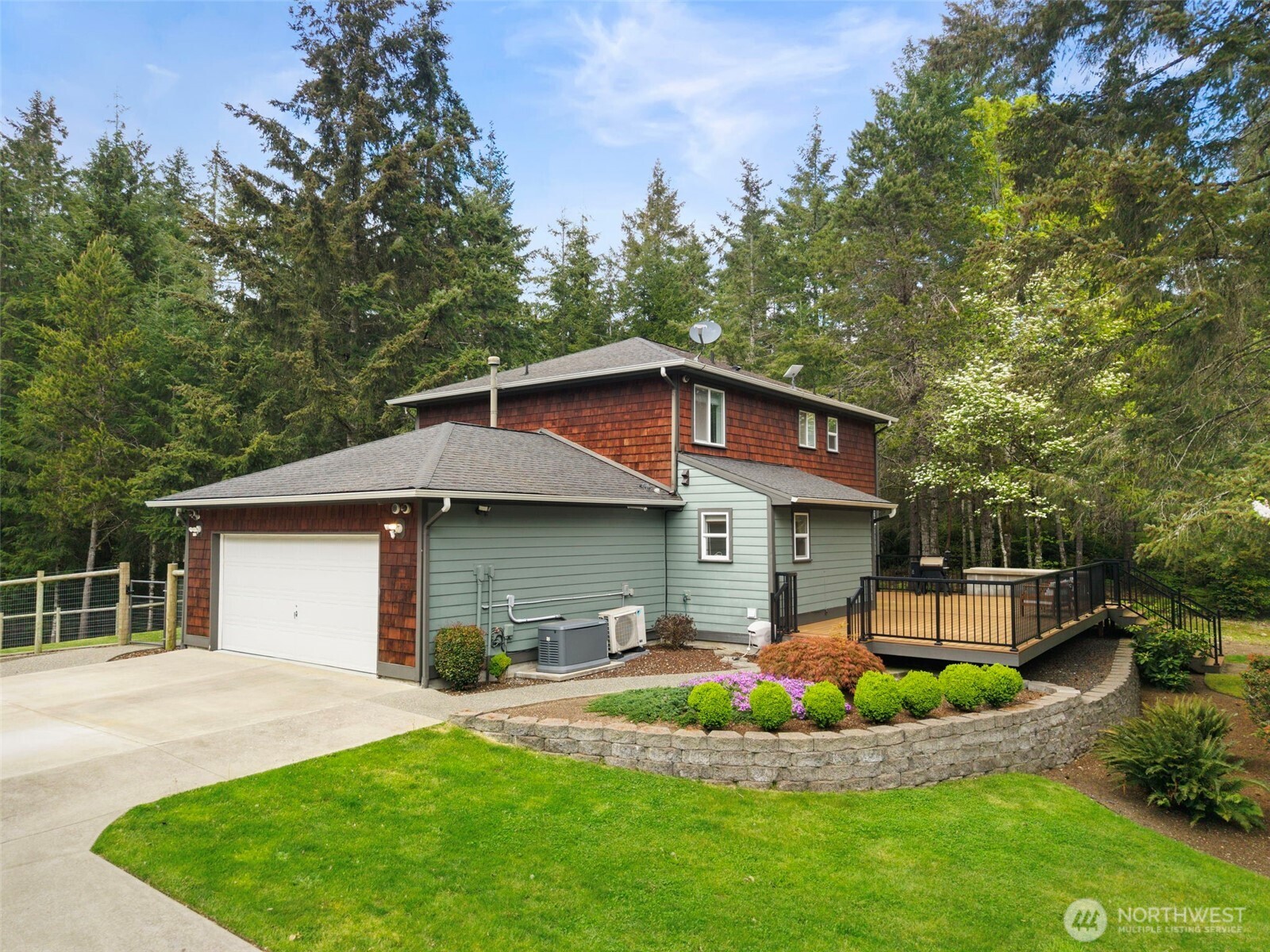15219 Wright Bliss Road Northwest Gig Harbor, WA 98329 - Photo 4 of 39 a front view of house with yard and green space