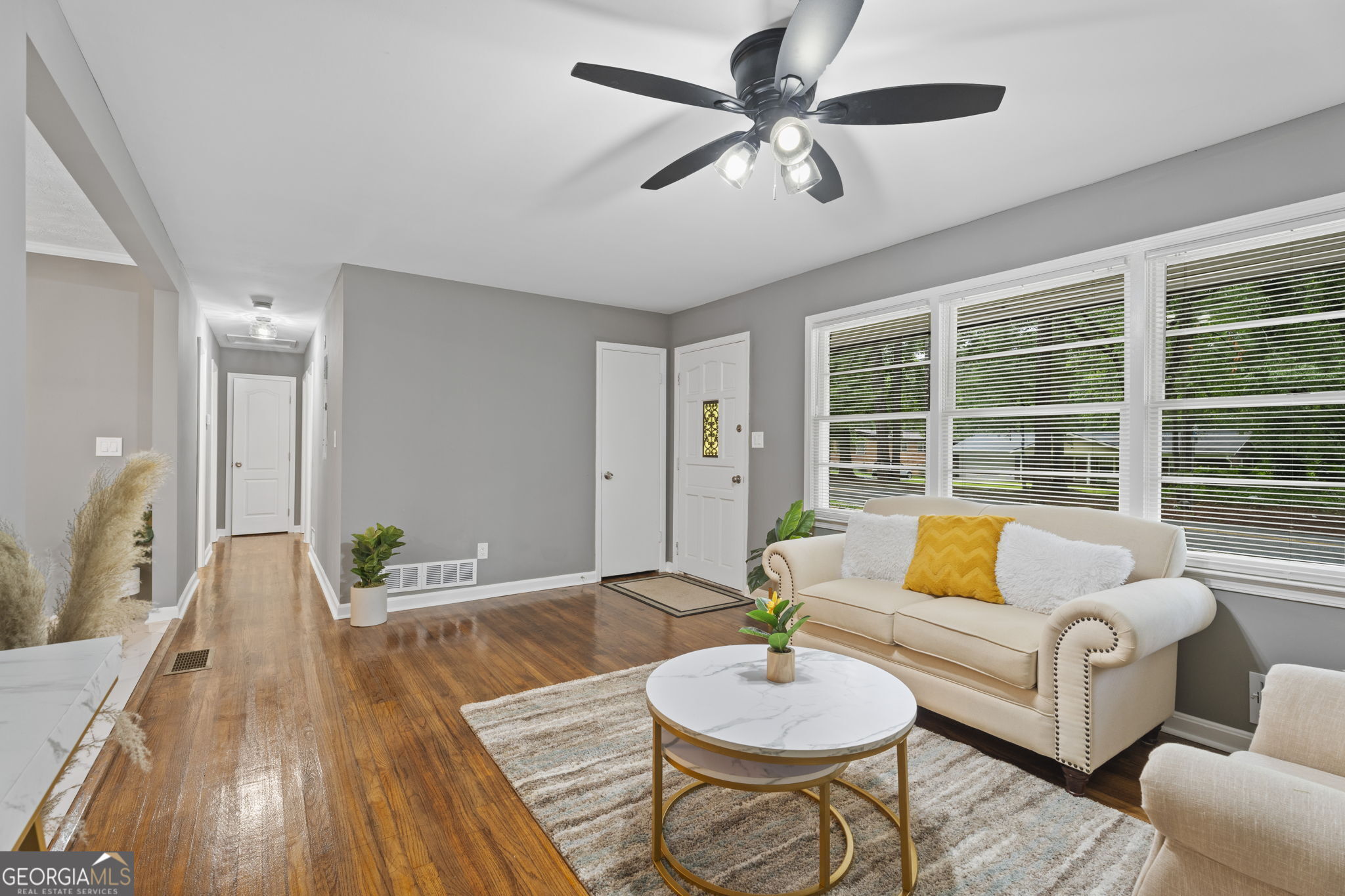 3567 Forrest Park Road Southeast Atlanta, GA 30354 - Photo 8 of 29 a living room with furniture and a large window
