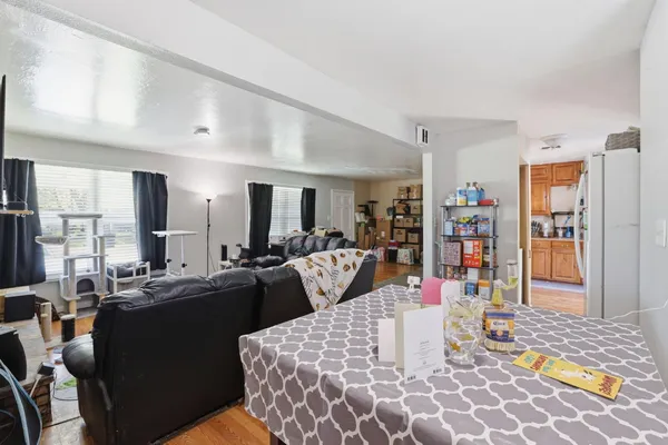 a very nice looking dining room with a large mirror