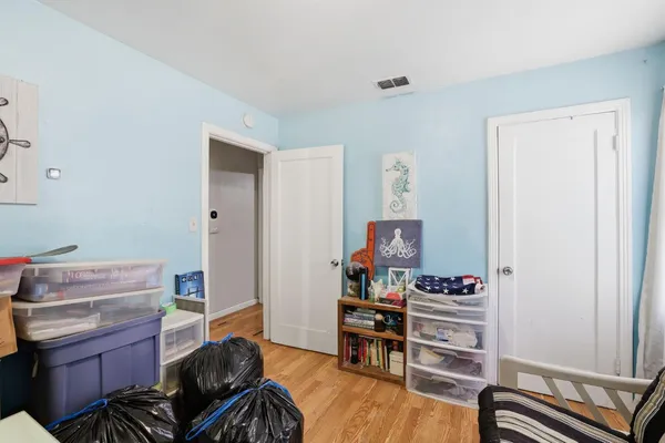a livingroom with workspace and a window