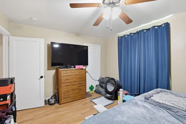 a room with furniture and flat screen tv