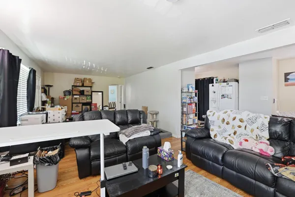 a living room with furniture and a table