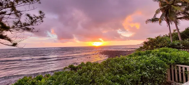 a view of a street with an ocean view
