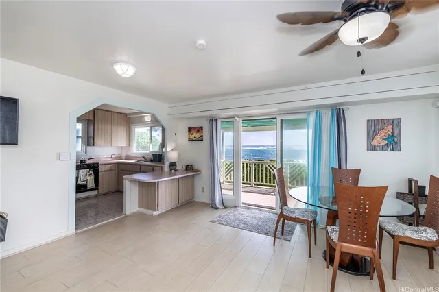 a open kitchen with a table and chairs
