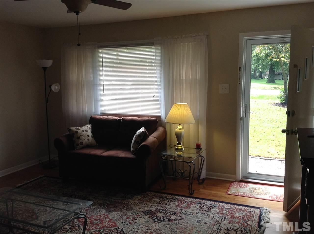 308 Grovemont Road Raleigh, NC 27603 - Photo 5 of 9 a living room with furniture and a window