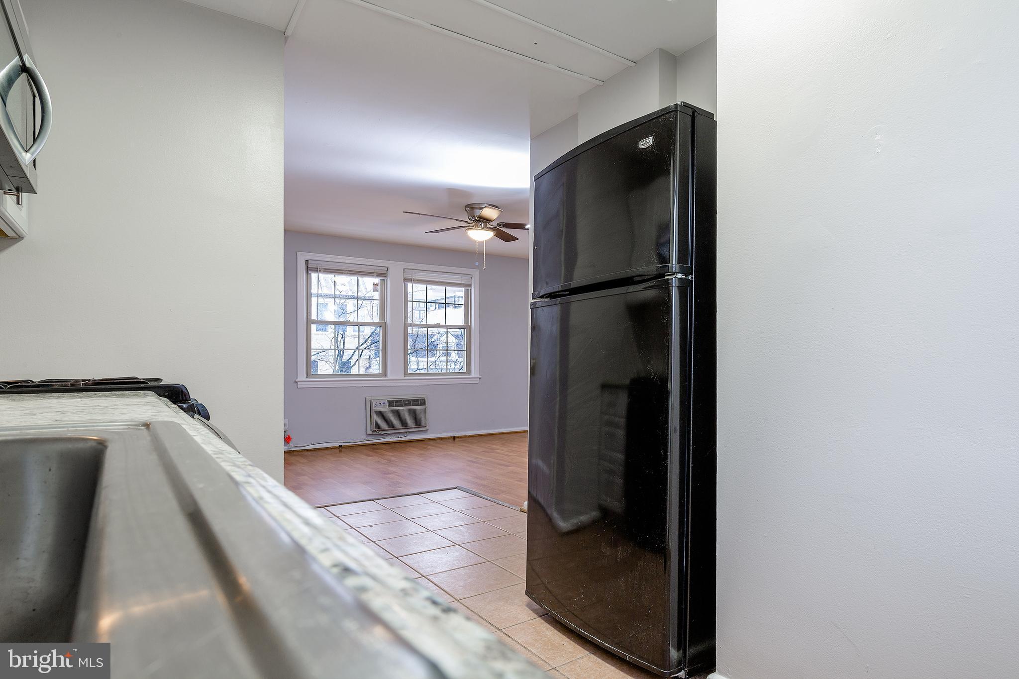 2415 Ontario Road Northwest, Unit 301 Washington, DC 20009 - Photo 13 of 25 a view of an empty room with glass door