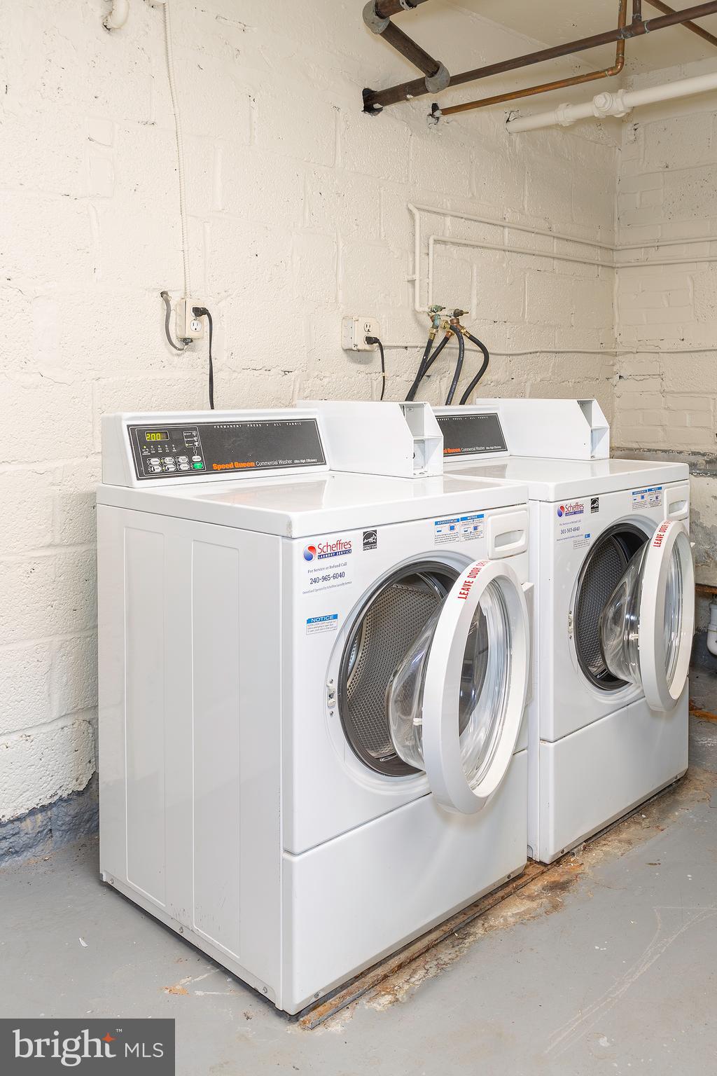 2415 Ontario Road Northwest, Unit 301 Washington, DC 20009 - Photo 24 of 25 a utility room with dryer and washer
