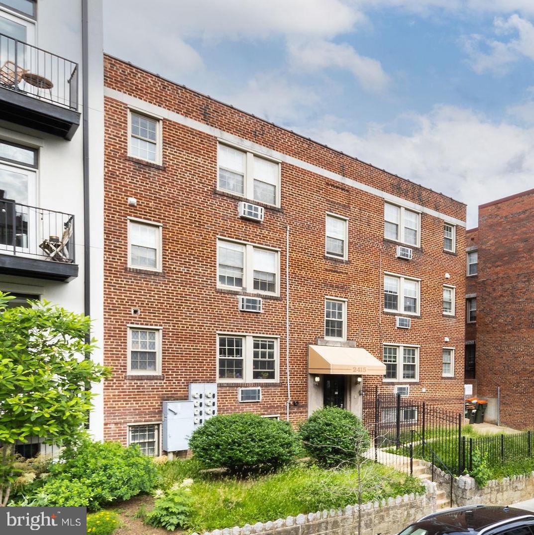2415 Ontario Road Northwest, Unit 301 Washington, DC 20009 - Photo 6 of 25 a front view of a building with garden