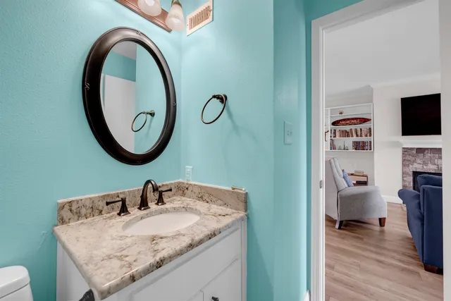 a bathroom with a sink and a mirror