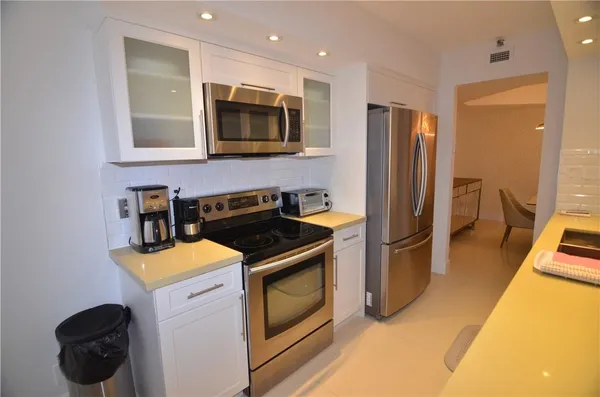 a kitchen with a stove and a microwave