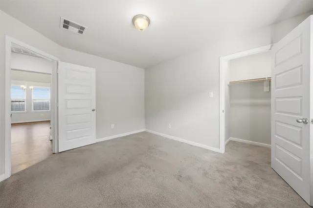 a bathroom with a shower a toilet and a shower