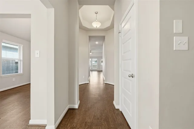 an empty room with wooden floor and closet