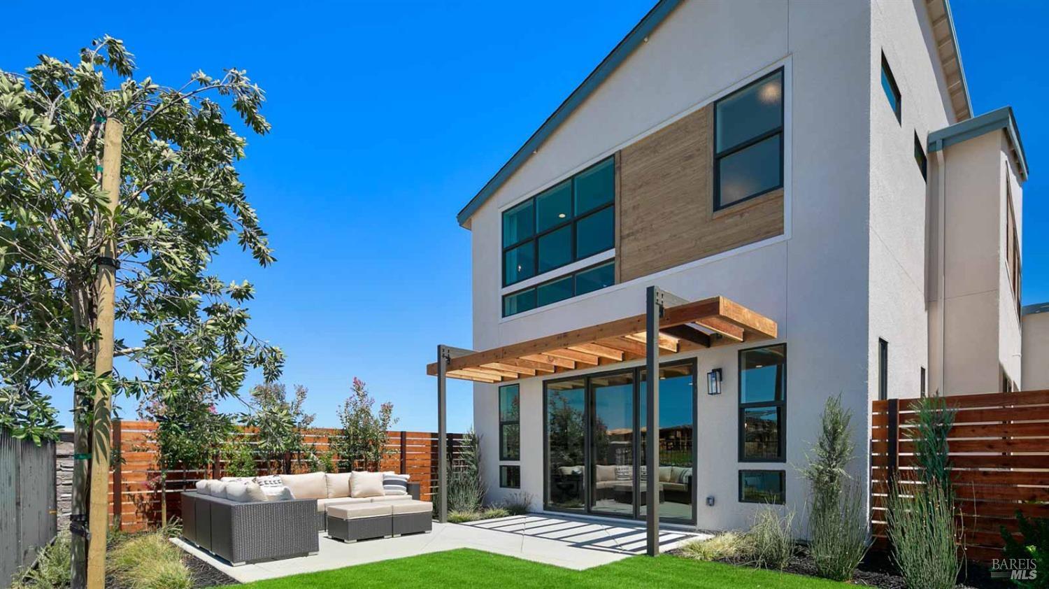a view of an house with backyard porch and furniture