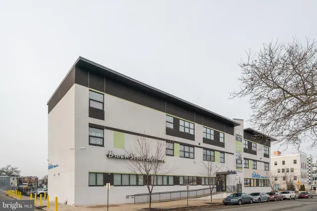 a tall building sitting on the side of a street
