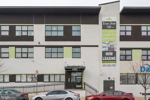 a front view of a building with glass windows