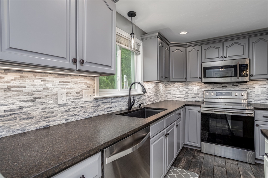 358 Dudley Road Templeton, MA 01468 - Photo 9 of 42 a kitchen with sink cabinets and microwave