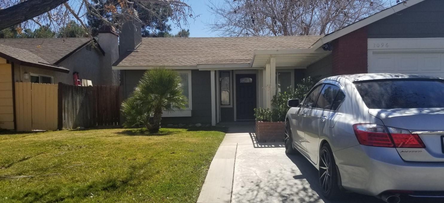 3096 East Avenue R-5 Palmdale, CA 93550 - Photo 1 of 22 a view of a house with a patio and a yard