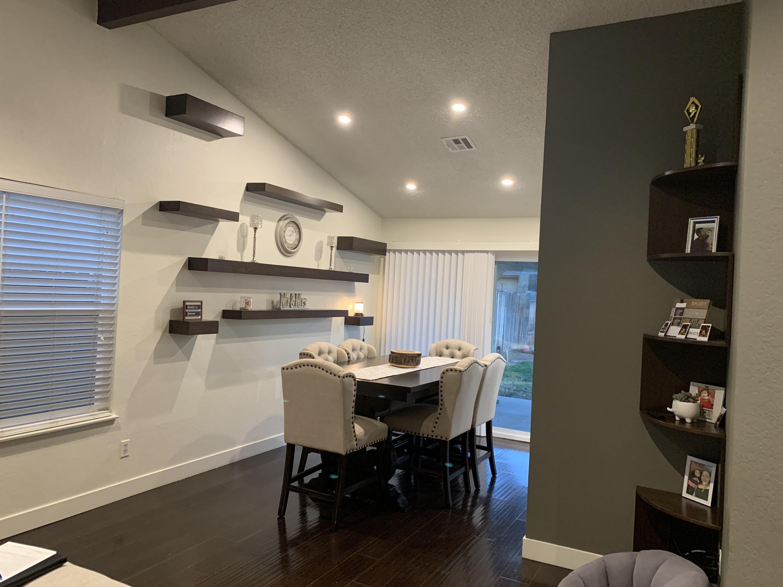 3096 East Avenue R-5 Palmdale, CA 93550 - Photo 7 of 22 a view of a dining room with furniture and wooden floor