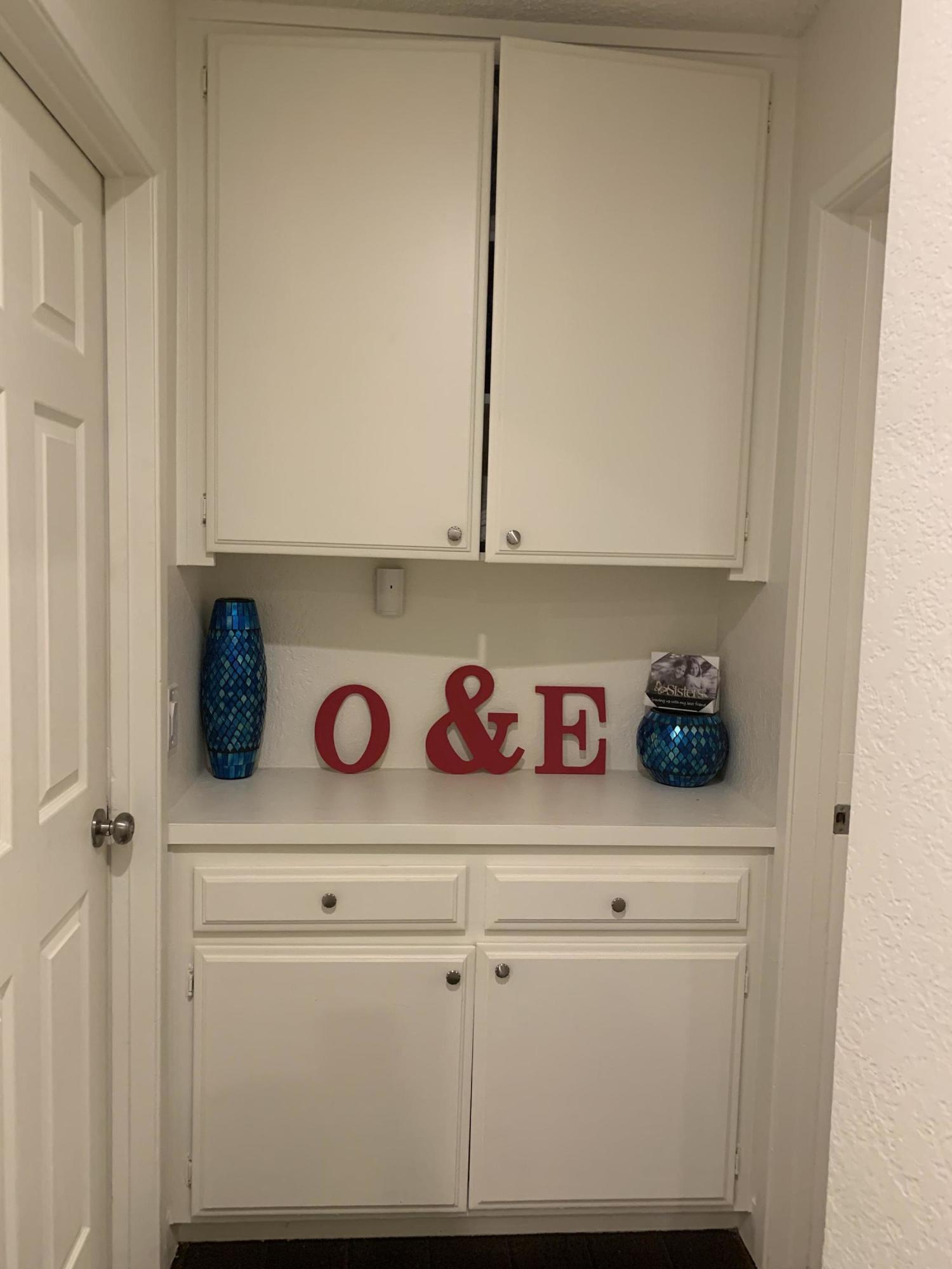 3096 East Avenue R-5 Palmdale, CA 93550 - Photo 9 of 22 a view of cabinets and has wooden floor