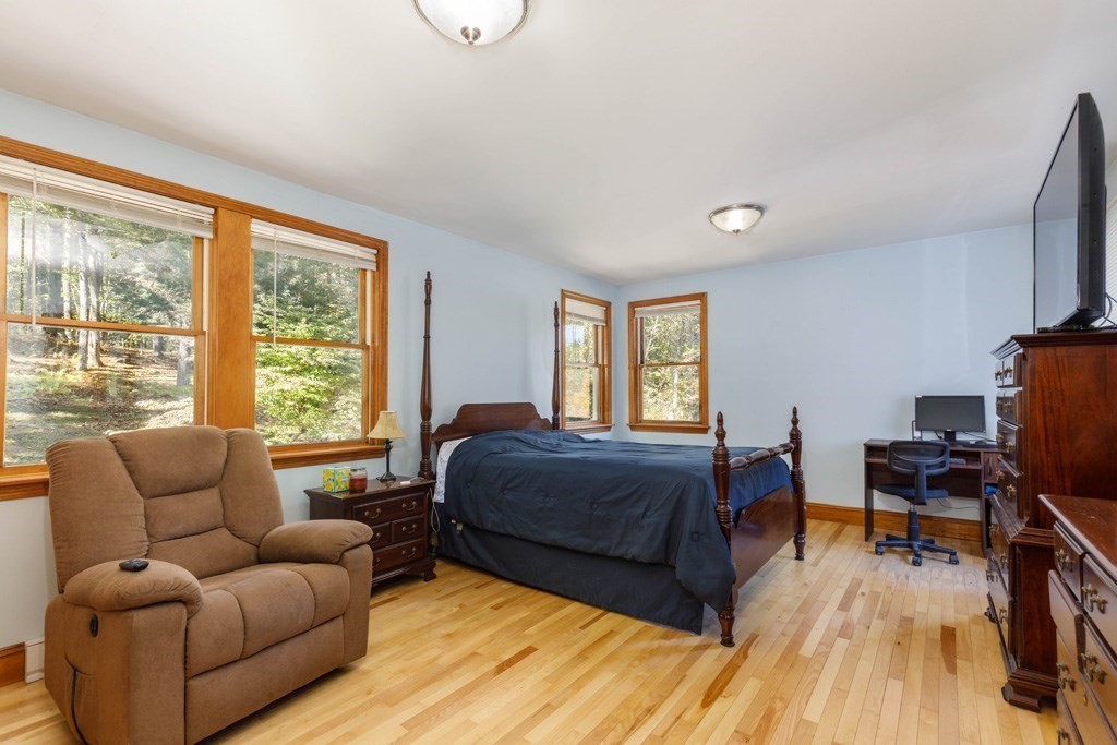 283 Mill Street Gardner, MA 01440 - Photo 11 of 30 a living room with a bed furniture and a flat screen tv